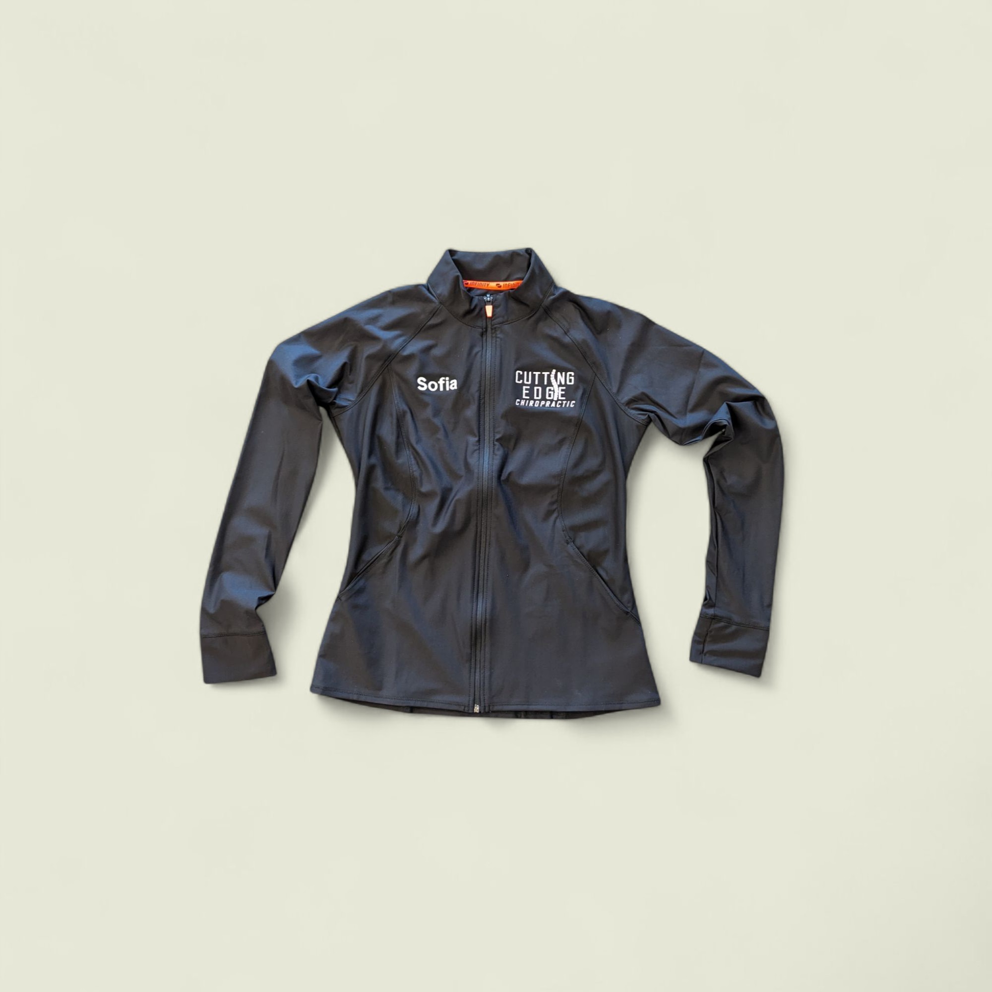 Cutting Edge Chiropractic logo embroidered on a zip jacket with staff name