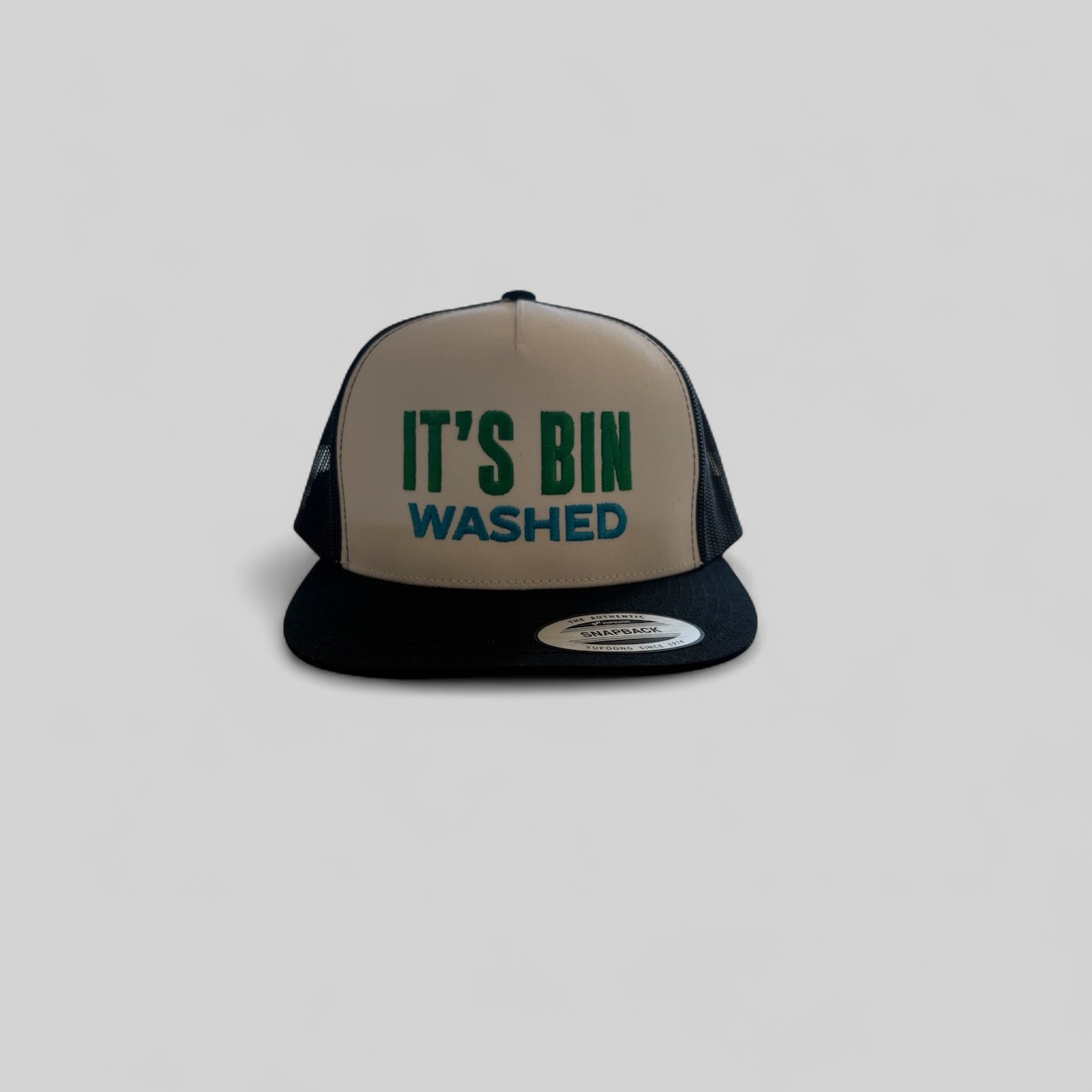 Snapback hat custom embroidered with a novelty “It's Bin Washed” design